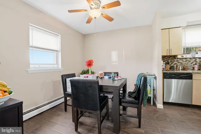 a view of a dining room with furniture and window