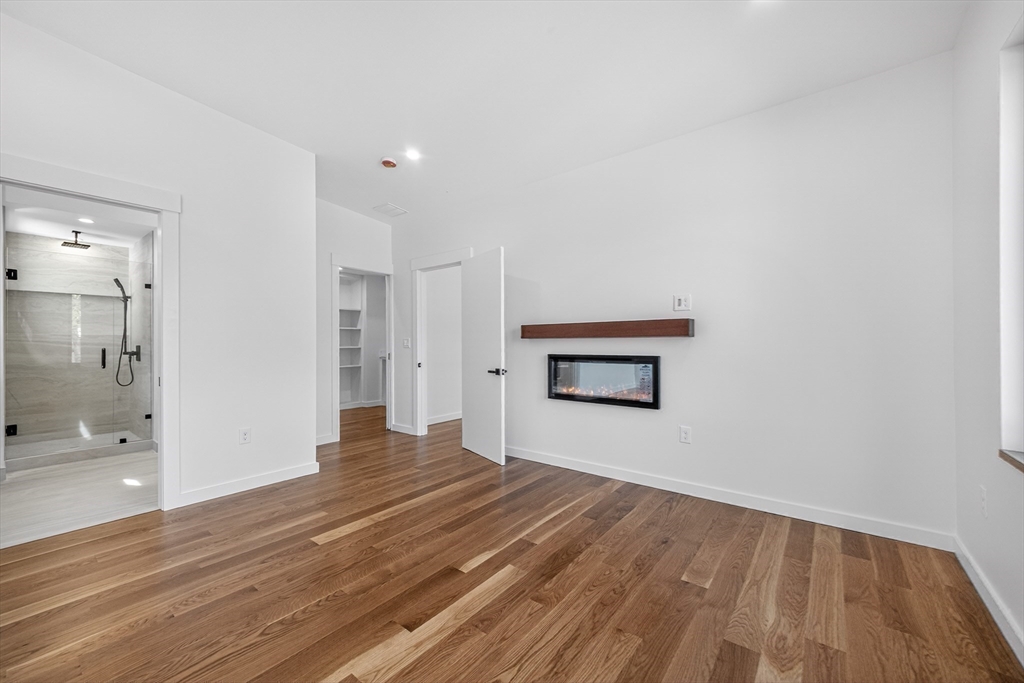 15 Bird Hill Road Lexington, MA 02421 - Photo 20 of 34 a view of empty room with wooden floor and windows