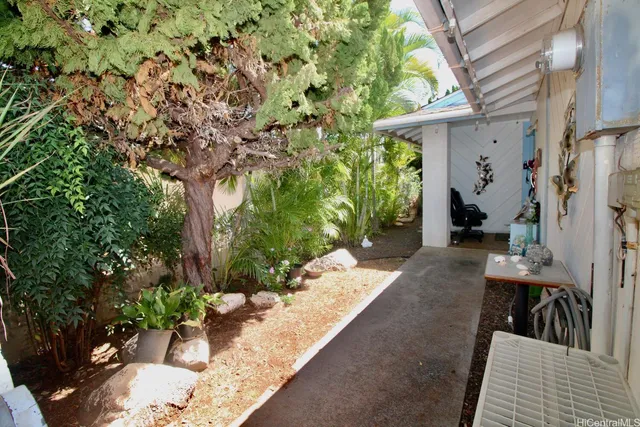 a spacious bedroom with a bed and a flat screen tv