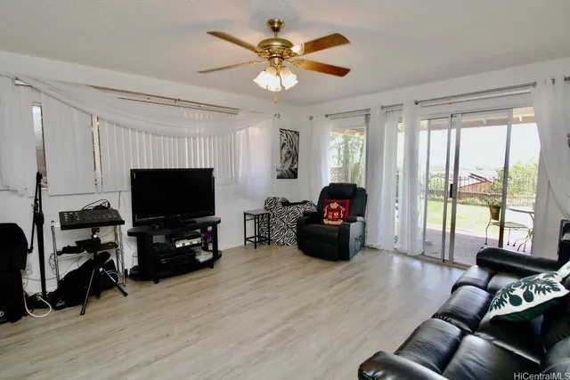 a kitchen with stainless steel appliances granite countertop a refrigerator a stove and a sink