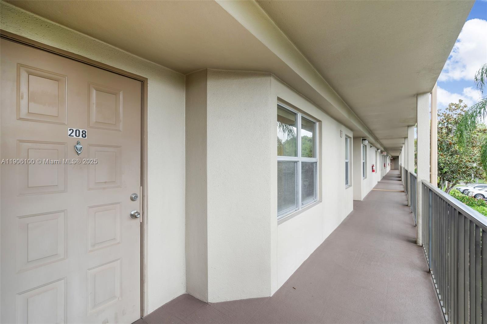 550 Southwest 137th Avenue, Unit 208L Pembroke Pines, FL 33027 - Photo 15 of 18 a view of a narrow alley