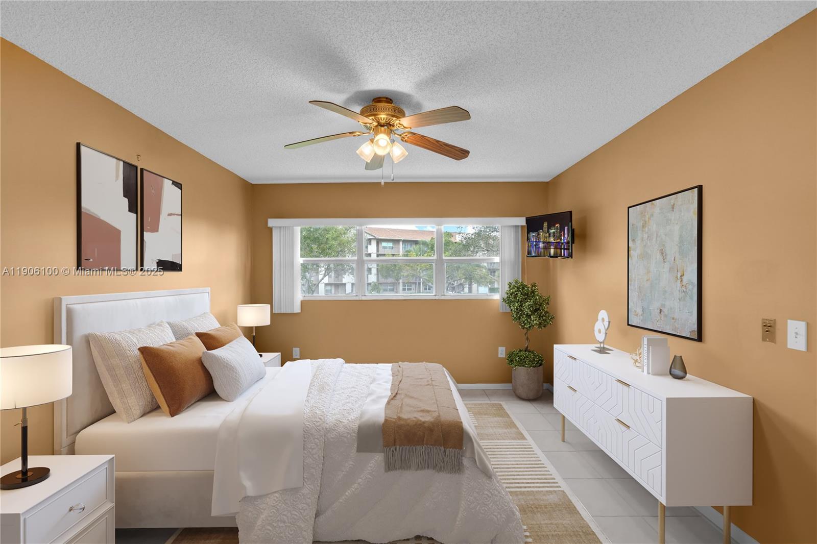 550 Southwest 137th Avenue, Unit 208L Pembroke Pines, FL 33027 - Photo 7 of 18 a bedroom with a large bed and a chandelier