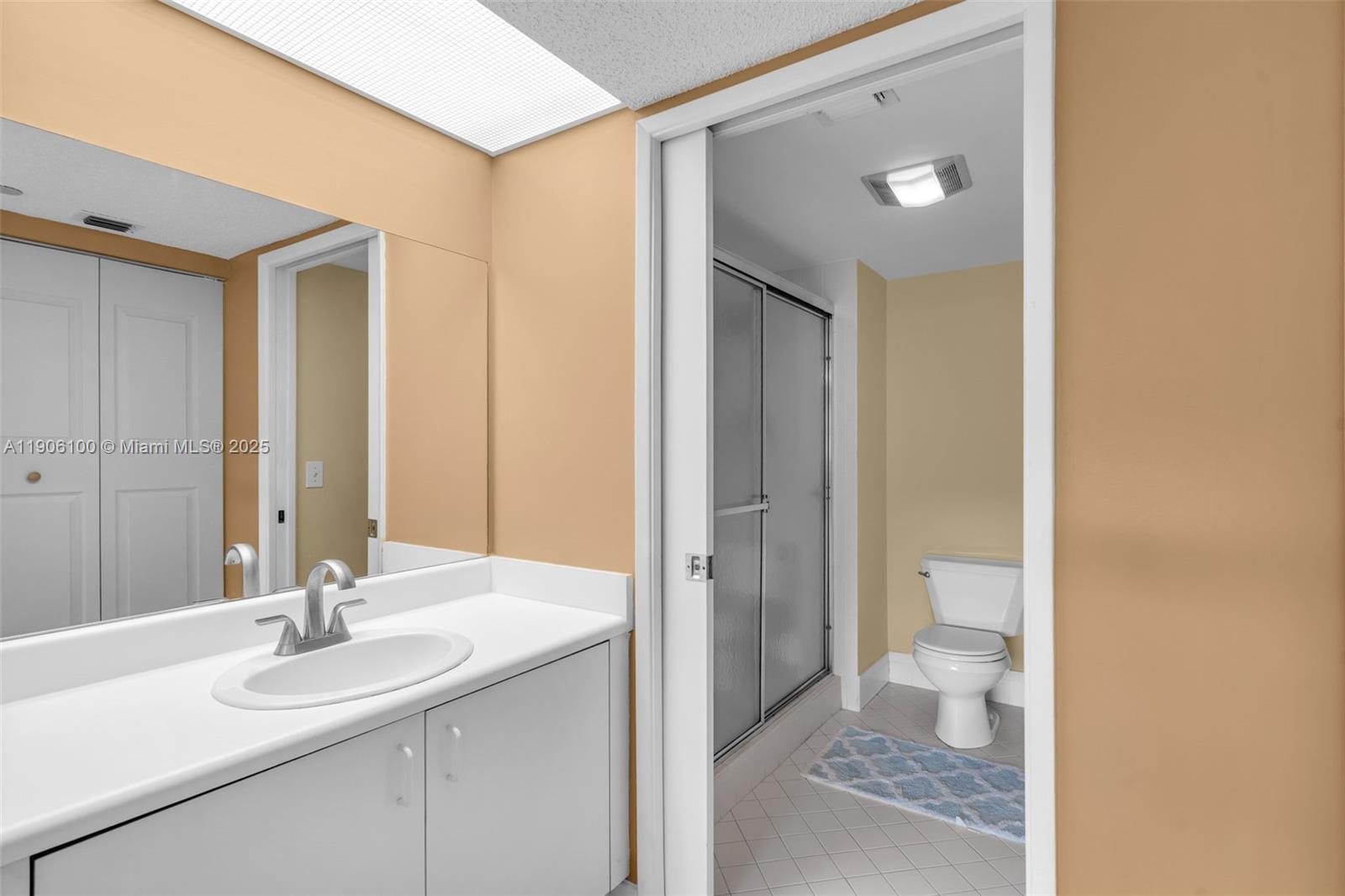 550 Southwest 137th Avenue, Unit 208L Pembroke Pines, FL 33027 - Photo 8 of 18 a bathroom with a sink and a mirror