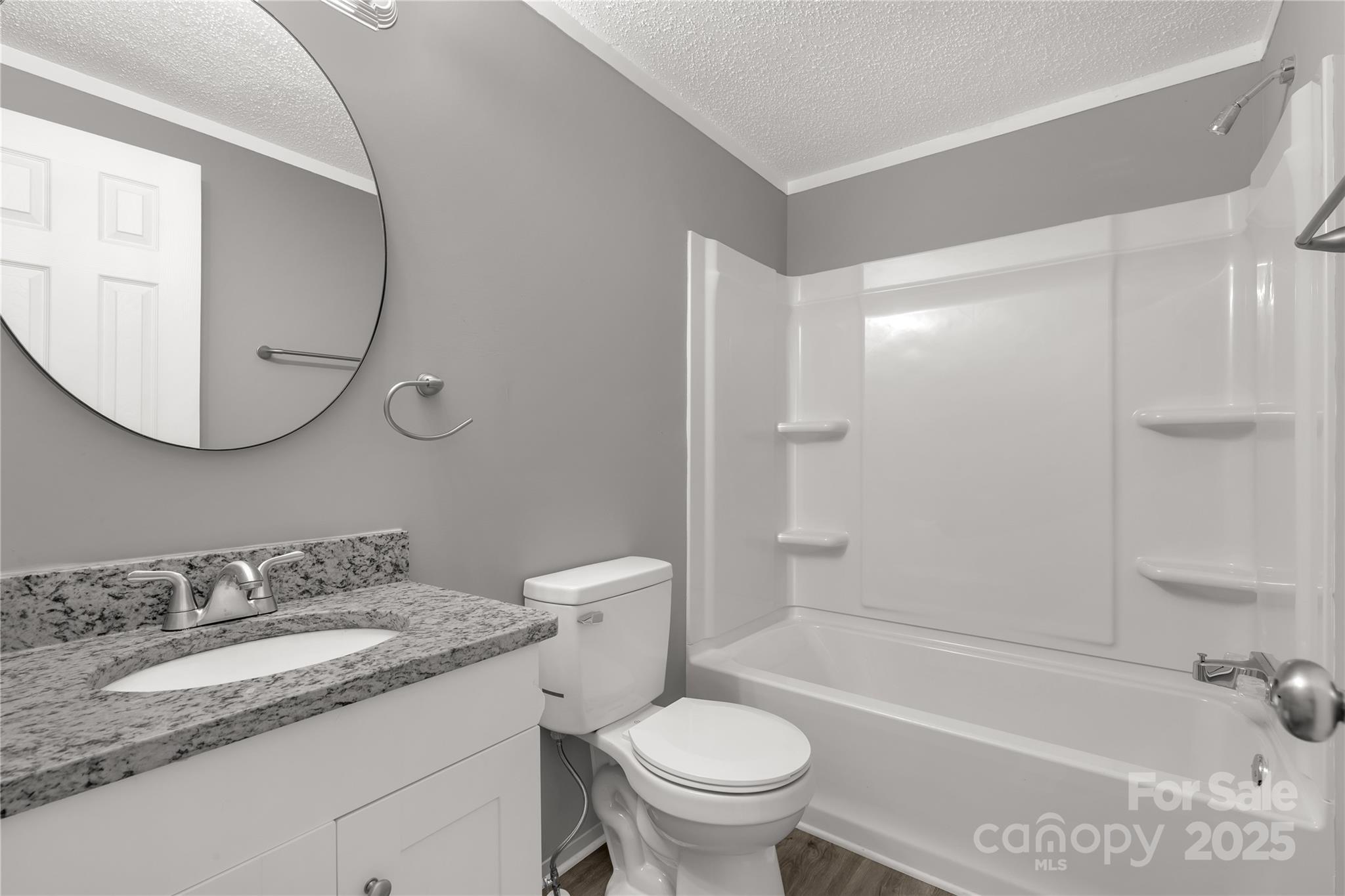 2005 Sugar Hill Road York, SC 29745 - Photo 14 of 32 a bathroom with a granite countertop sink toilet and shower