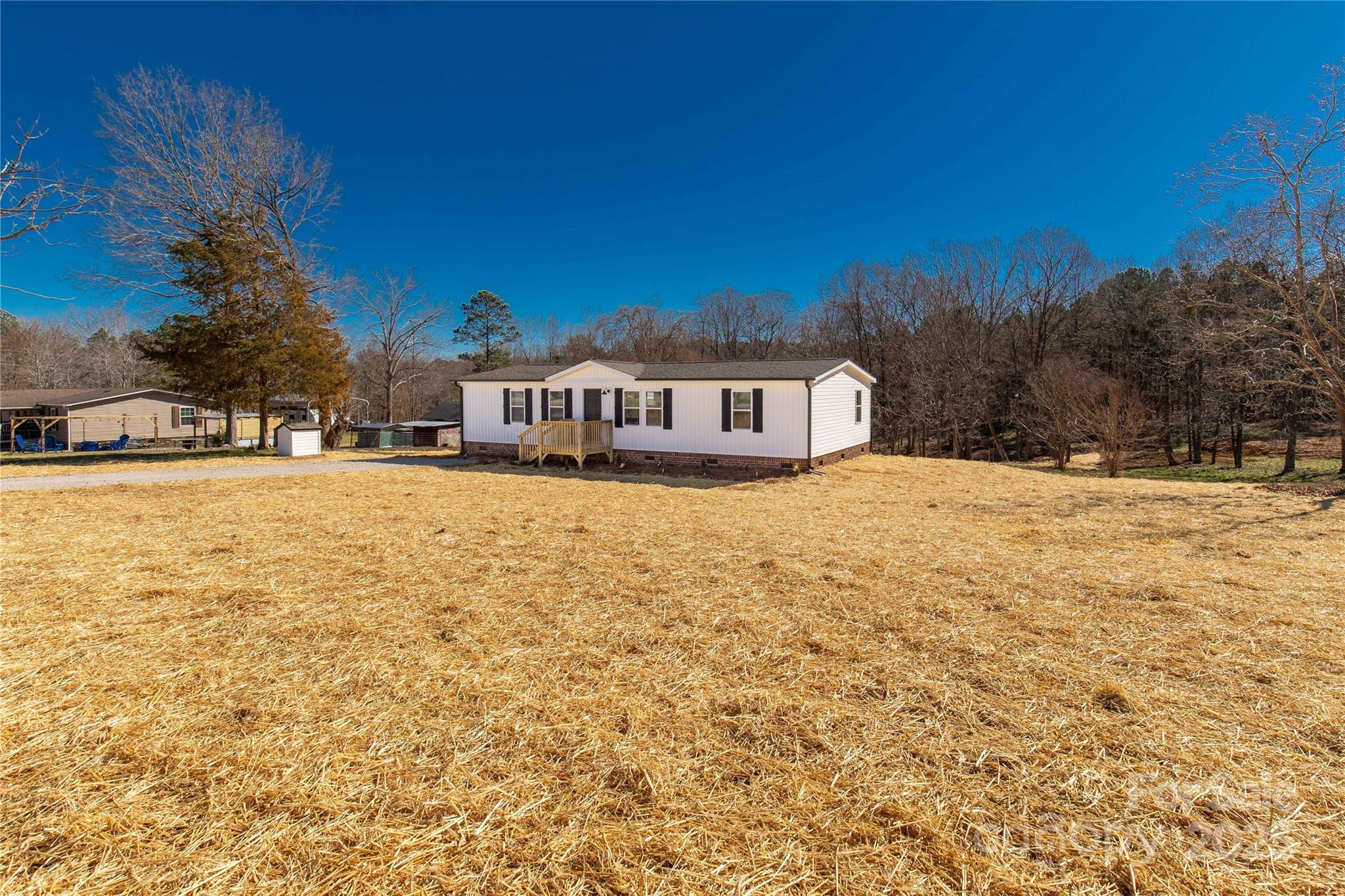 2005 Sugar Hill Road York, SC 29745 - Photo 22 of 32 a view of a yard with a house in the background