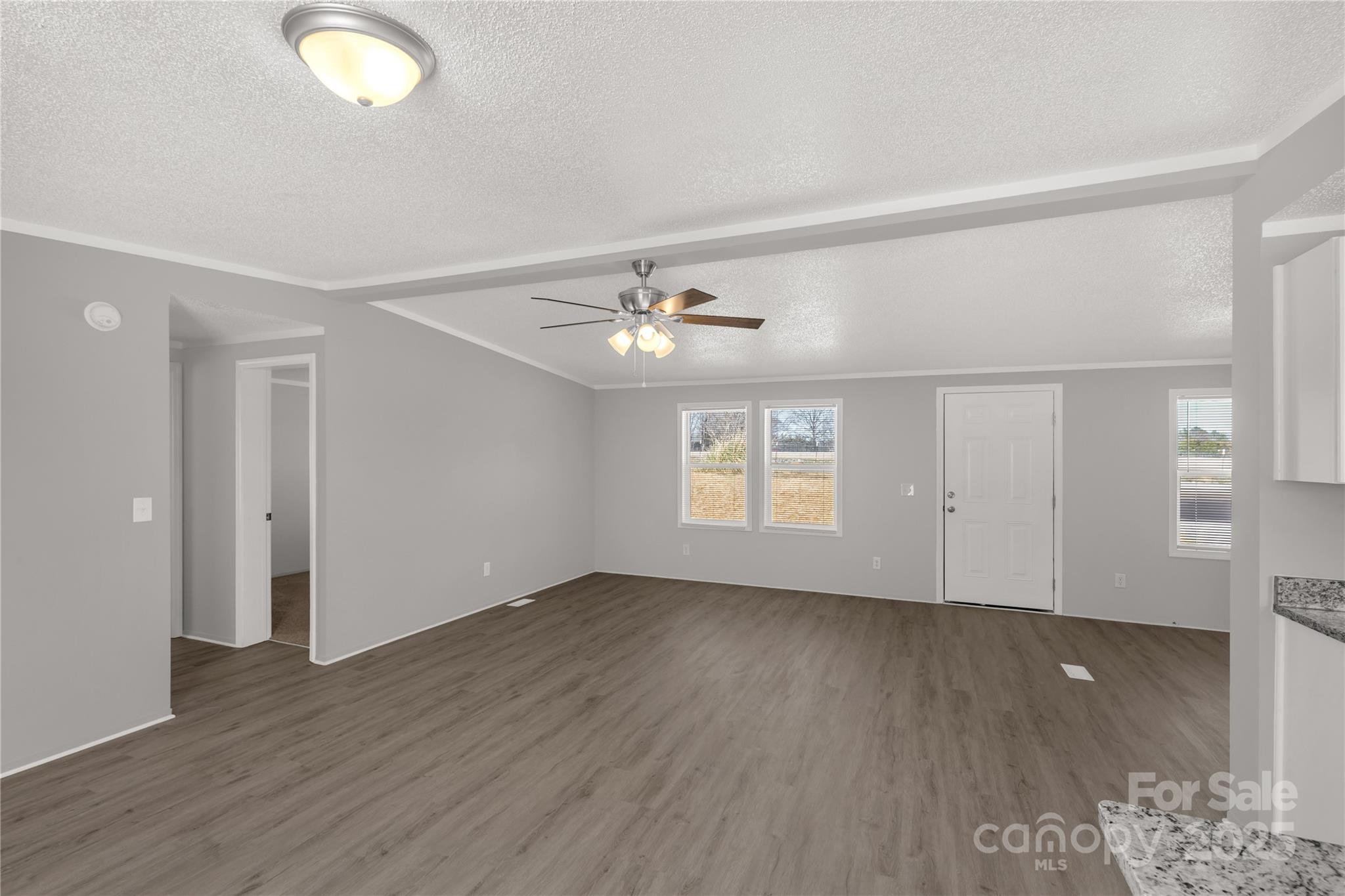 2005 Sugar Hill Road York, SC 29745 - Photo 7 of 32 wooden floor in an empty room with a window