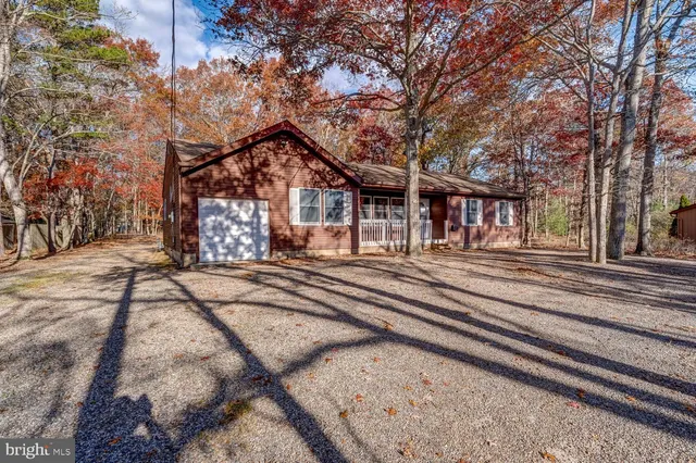 a view of a house with a snow on the road