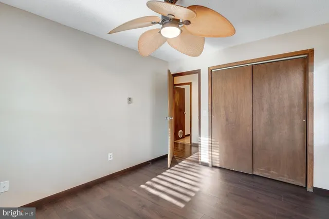 a view of an empty room and wooden floor