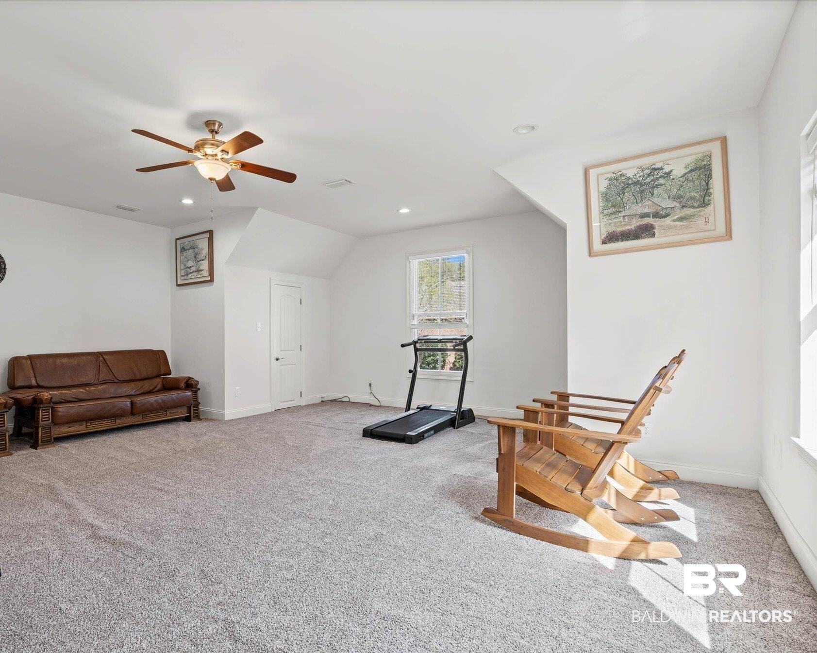3528 Rue Royal Mobile, AL 36693 - Photo 40 of 53 Living area with light colored carpet, a ceiling fan, recessed lighting, and lofted ceiling