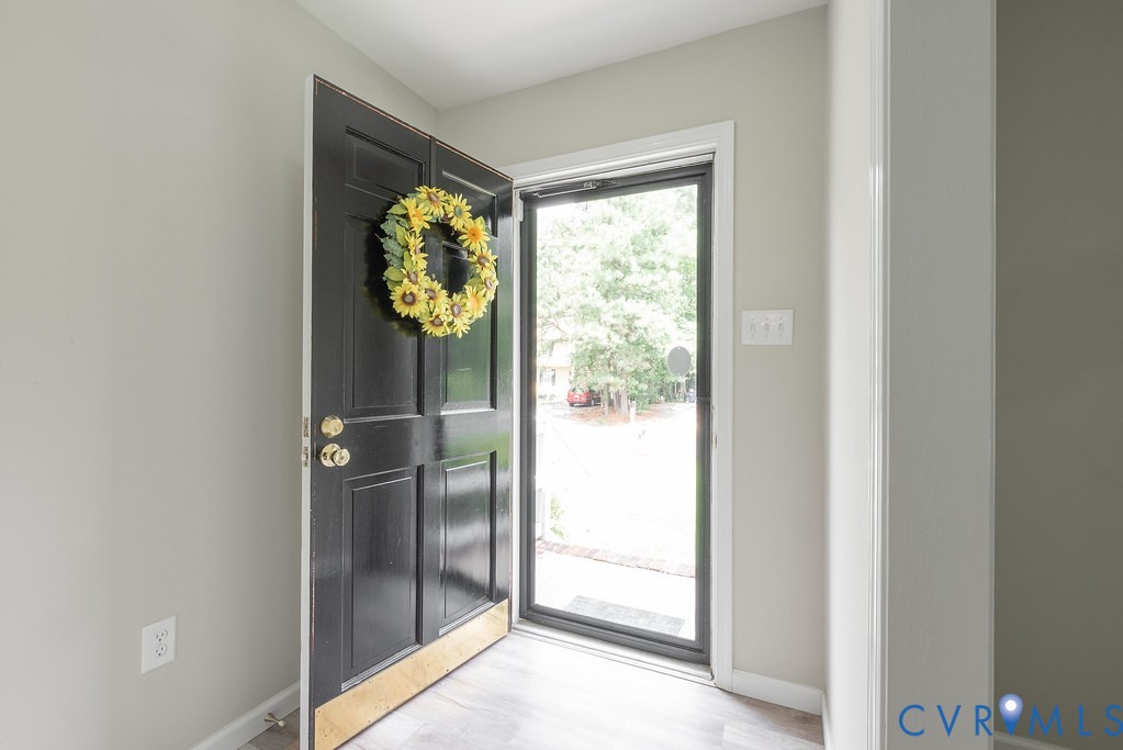 6901 Manning Road Chesterfield, VA 23832 - Photo 21 of 57 Black paneled entry door with brass hardware