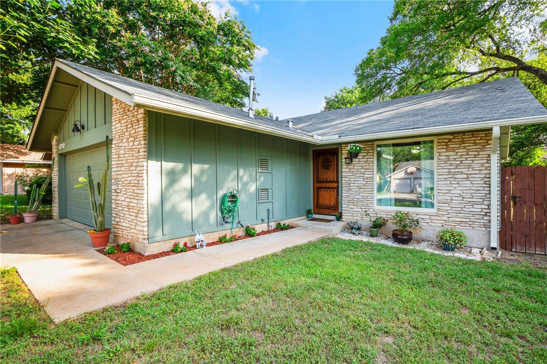 a view of a back yard with a patio