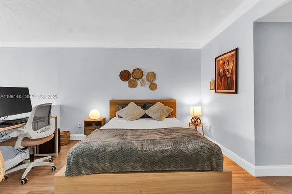 a bedroom with a bed and dresser