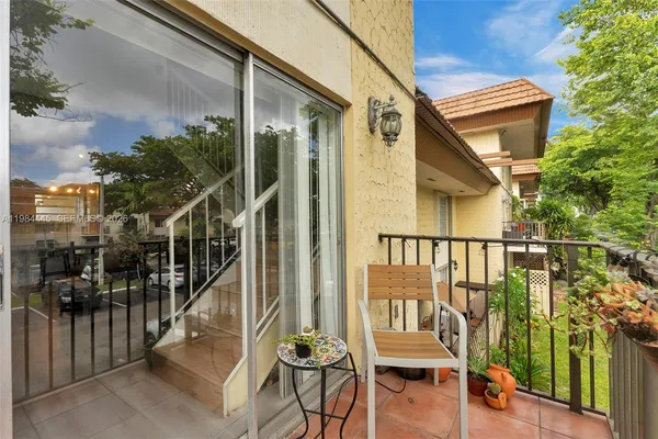 a view of a balcony with chairs