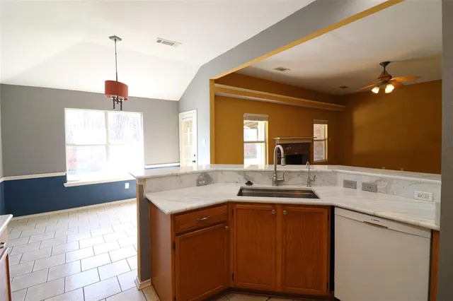 a kitchen with a sink and a window