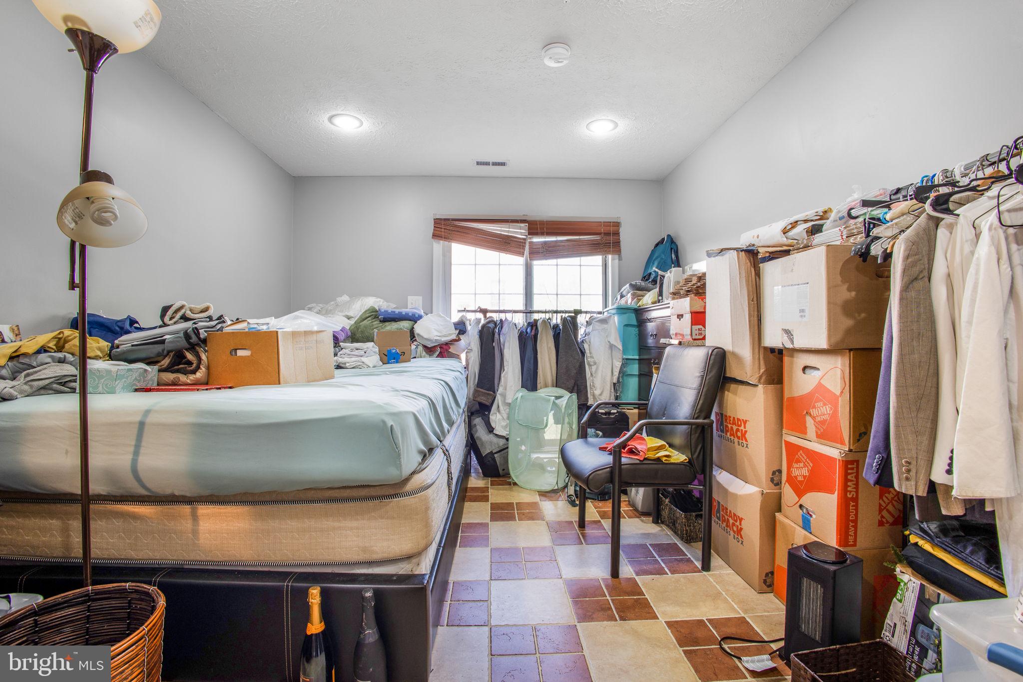 9820 Berrywood Court Bowie, MD 20721 - Photo 12 of 43 a bed room with furniture and a window