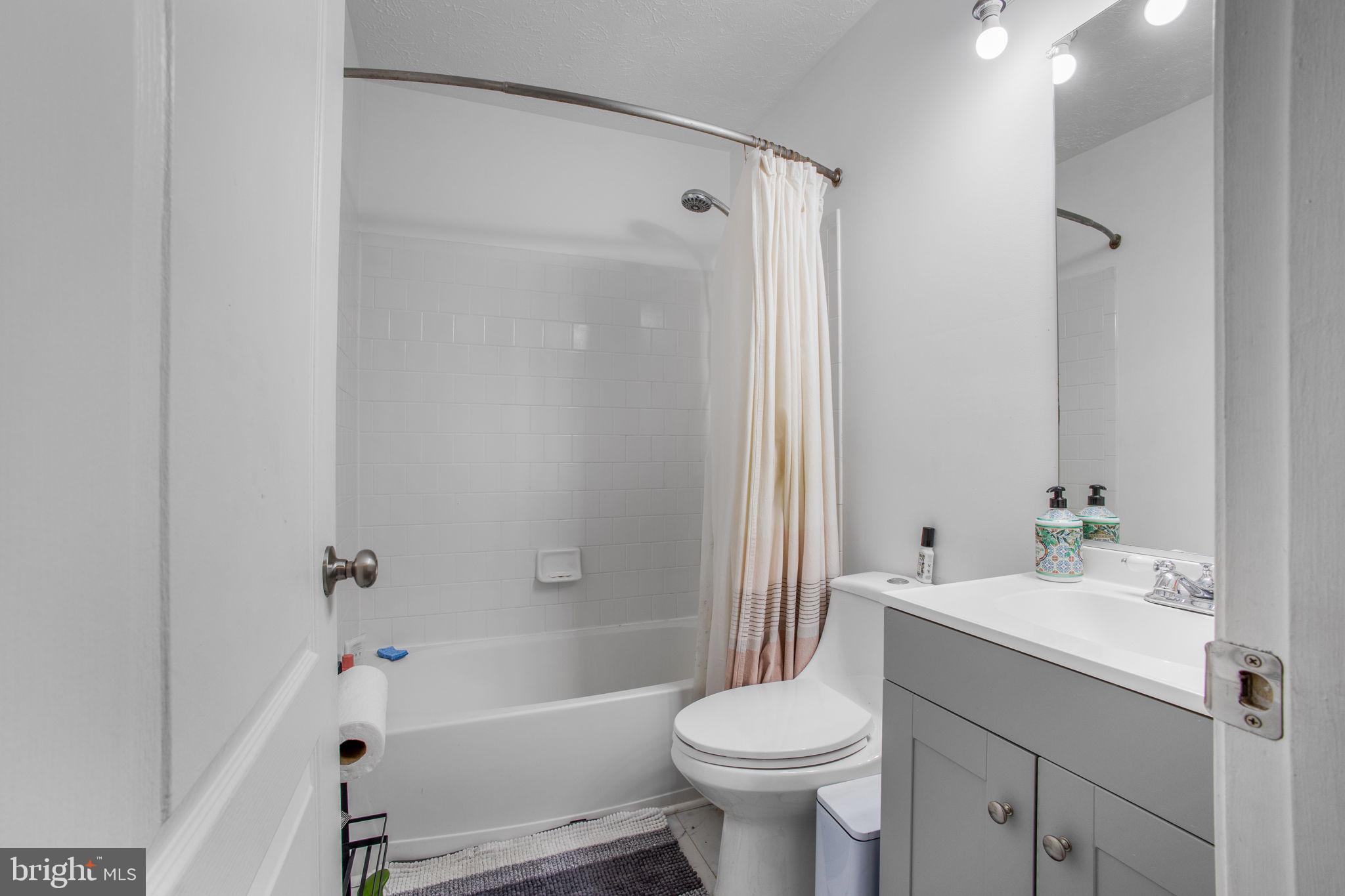 9820 Berrywood Court Bowie, MD 20721 - Photo 17 of 43 a bathroom with a sink toilet and shower