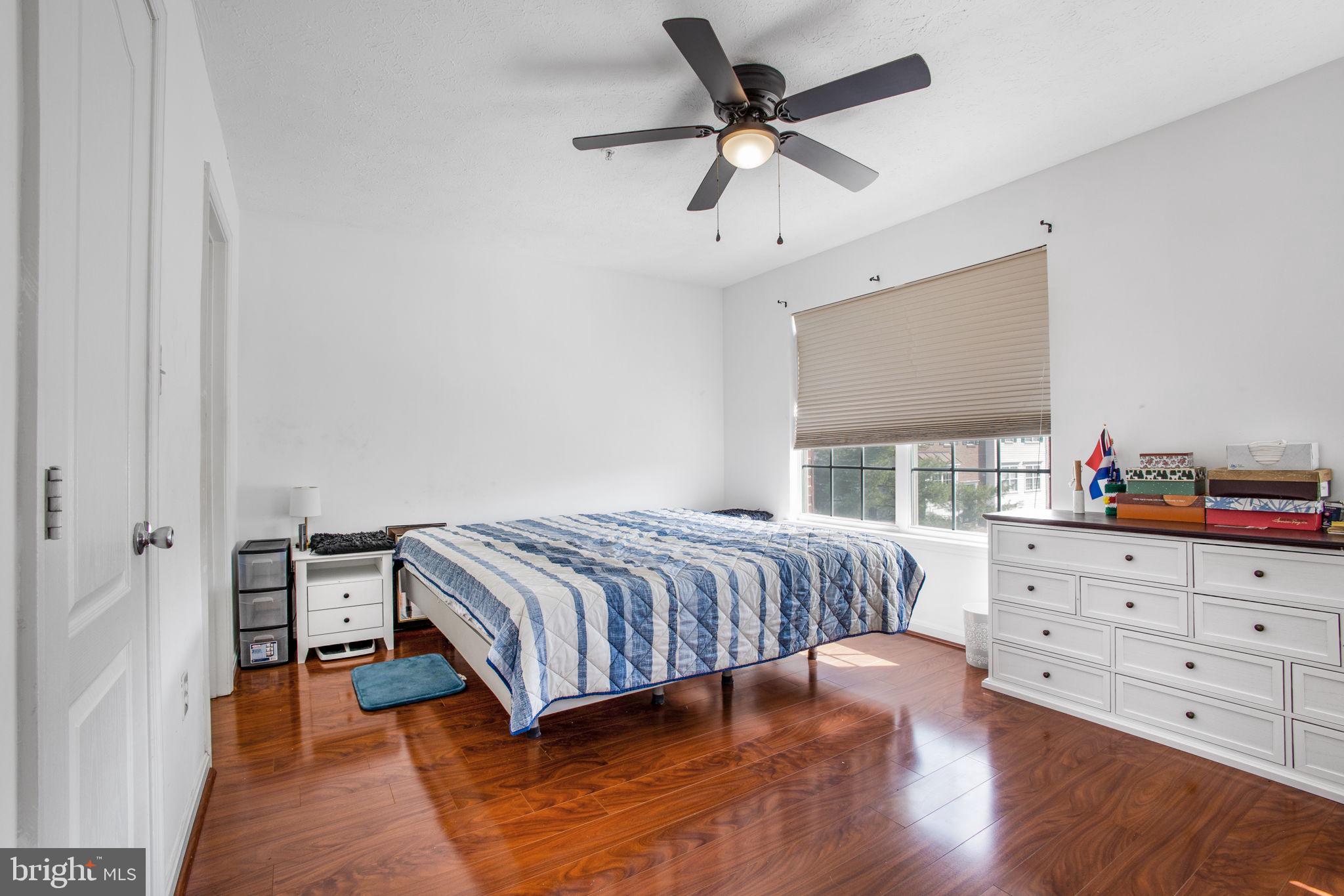 9820 Berrywood Court Bowie, MD 20721 - Photo 26 of 43 a bedroom with a bed and a dresser