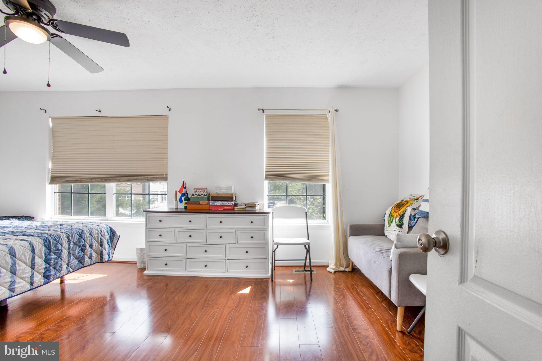 9820 Berrywood Court Bowie, MD 20721 - Photo 27 of 43 a bedroom with furniture and wooden floor