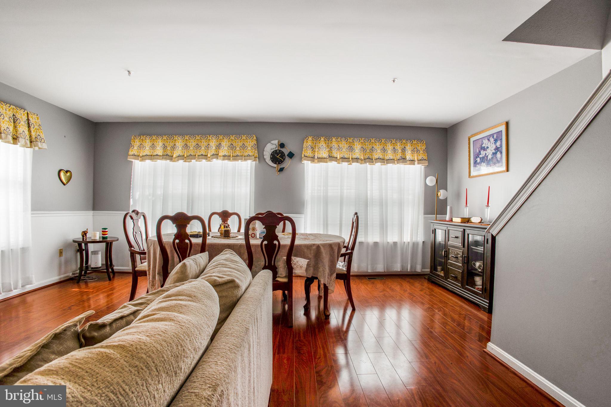 9820 Berrywood Court Bowie, MD 20721 - Photo 36 of 43 a living room with furniture and a large window
