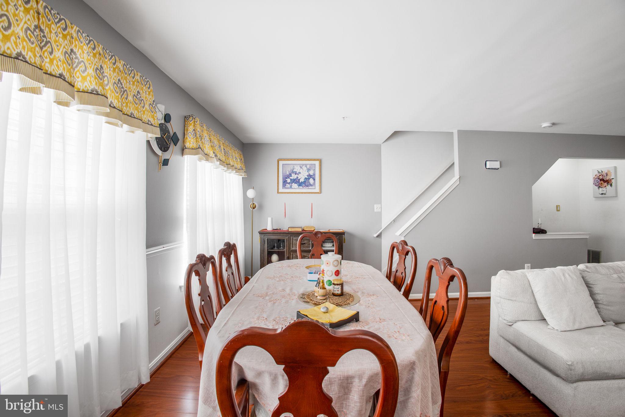 9820 Berrywood Court Bowie, MD 20721 - Photo 41 of 43 a dining room with furniture and a large window