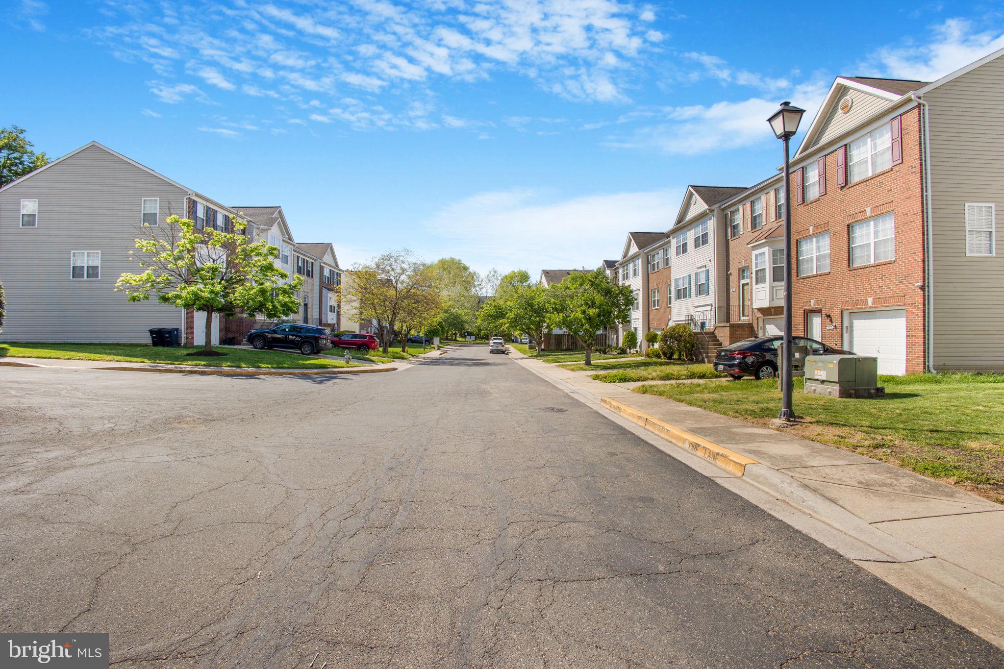9820 Berrywood Court Bowie, MD 20721 - Photo 5 of 43 a view of a street with a building in the background
