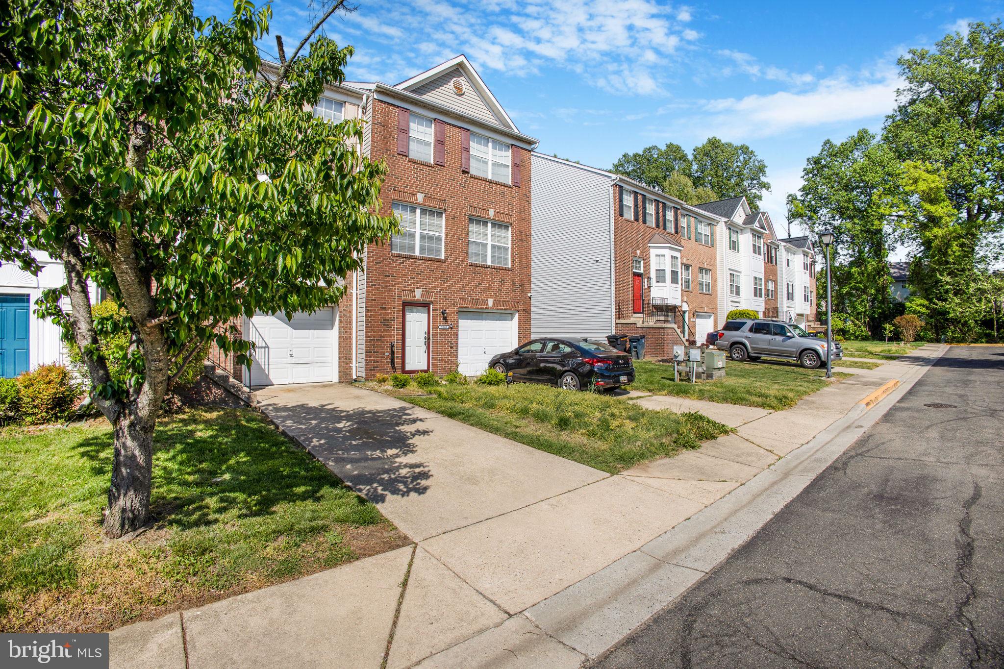 9820 Berrywood Court Bowie, MD 20721 - Photo 6 of 43 a front view of a building with garden
