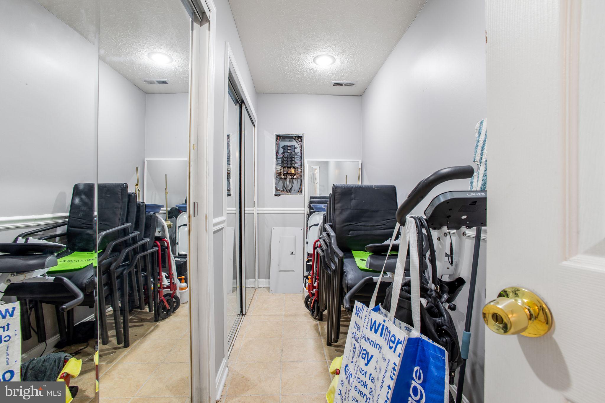 9820 Berrywood Court Bowie, MD 20721 - Photo 7 of 43 a view of a room with gym equipment