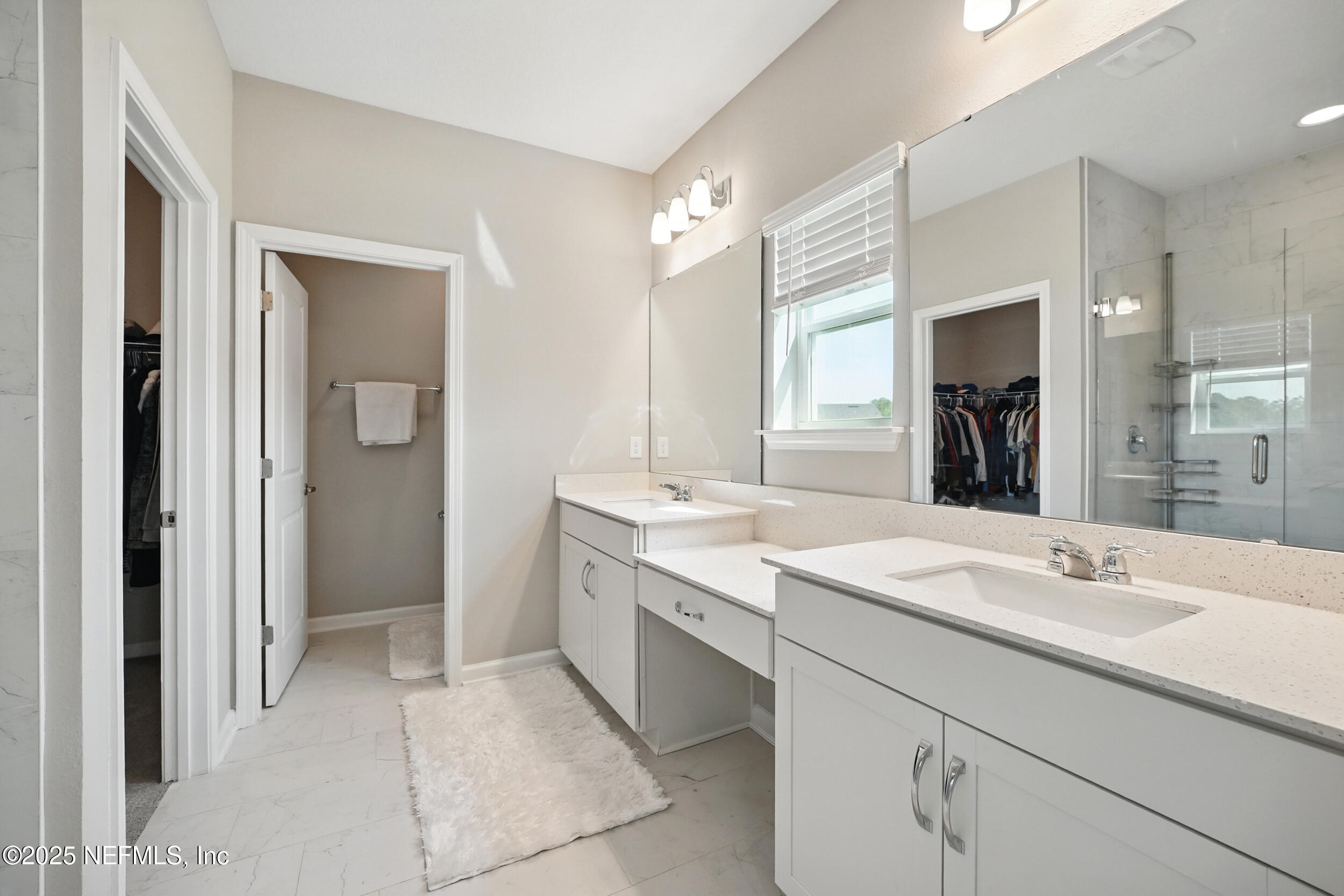 523 Silver Landing Drive St. Augustine, FL 32092 - Photo 27 of 63 a bathroom with a sink and a mirror
