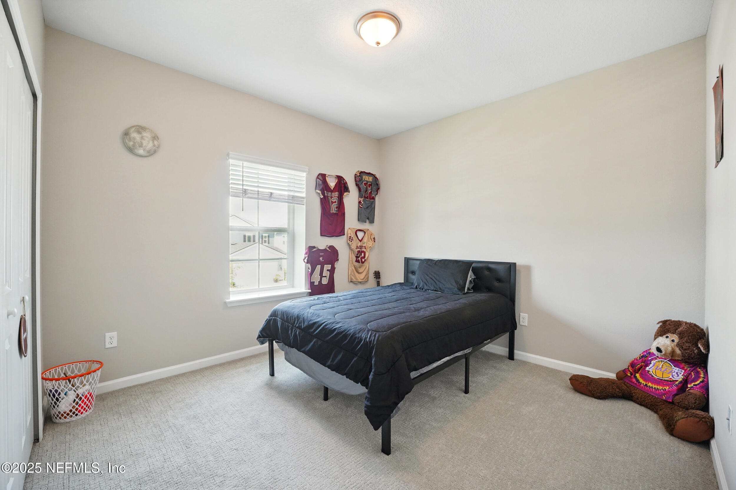 523 Silver Landing Drive St. Augustine, FL 32092 - Photo 31 of 63 a bedroom with a bed and a window