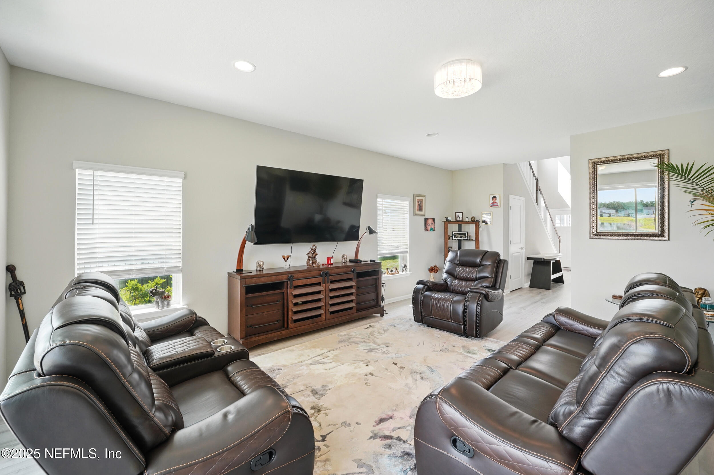 523 Silver Landing Drive St. Augustine, FL 32092 - Photo 5 of 63 a living room with furniture and a flat screen tv