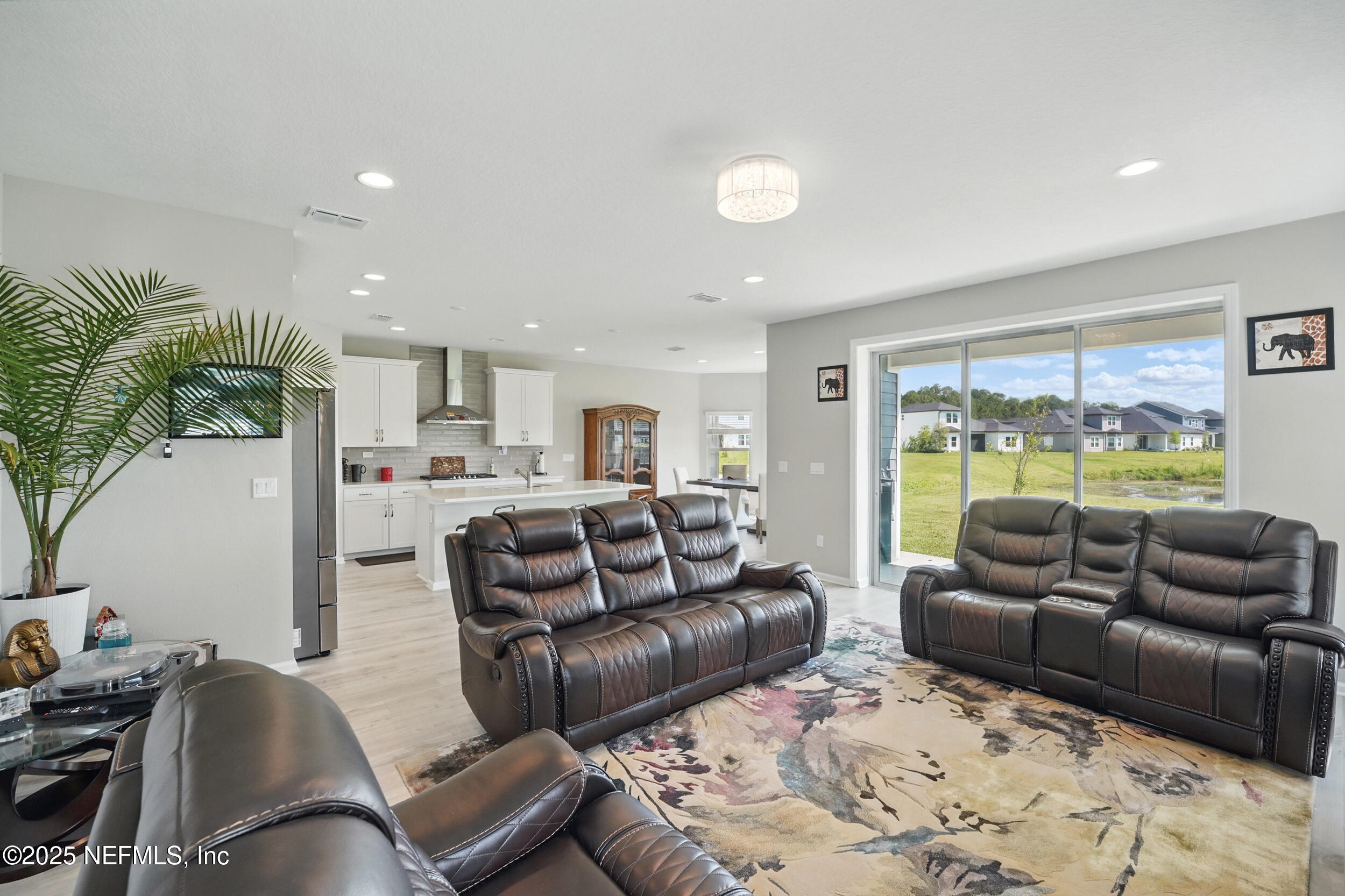 523 Silver Landing Drive St. Augustine, FL 32092 - Photo 7 of 63 a living room with furniture and a large window