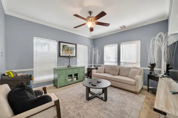 a living room with furniture and windows