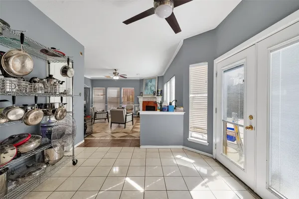a kitchen with stainless steel appliances kitchen island granite countertop a refrigerator a oven a sink with dishwasher and cabinets