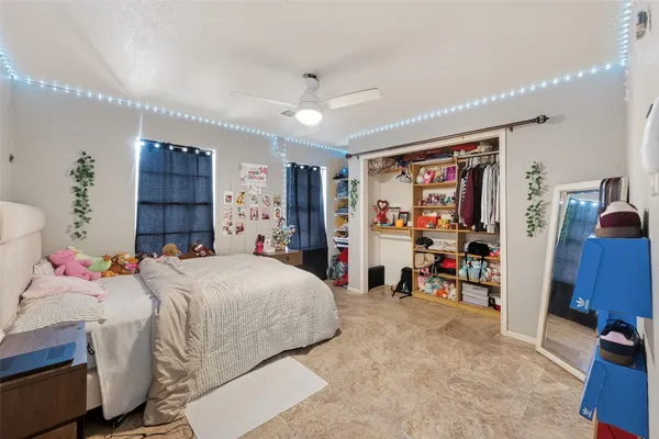 a bedroom with a bed and furniture