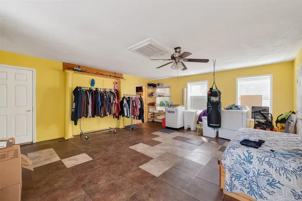 a view of a livingroom with furniture and a ceiling fan