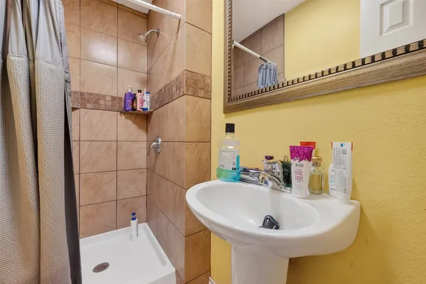 a bathroom with a sink and a mirror