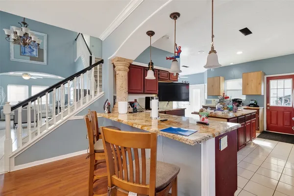 a view of a dining room and hall with furniture