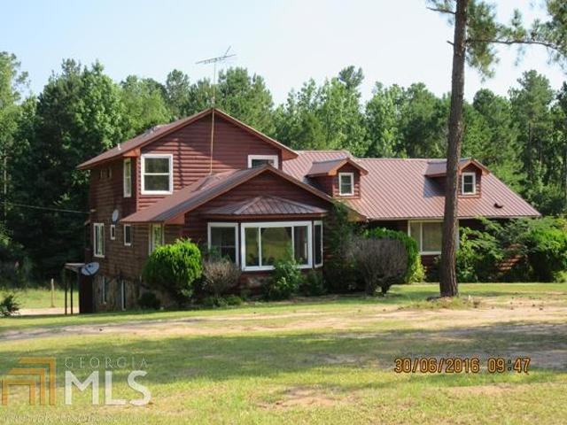 3051 Delhi Road Tignall, GA 30668 - Photo 1 of 1 a front view of a house with a yard