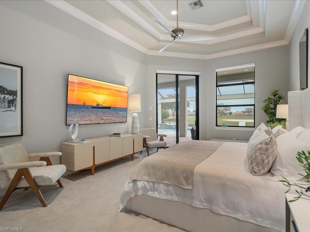 16337 Corsica Way Naples, FL 34110 - Photo 12 of 47 a bedroom with a bed and wooden floor