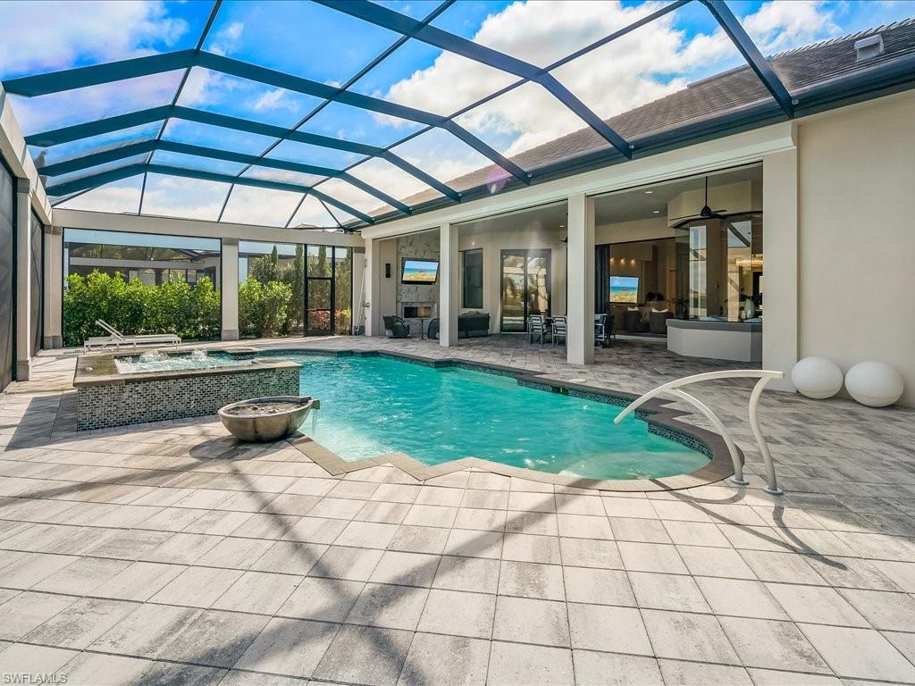 16337 Corsica Way Naples, FL 34110 - Photo 26 of 47 a view of a backyard with sitting area
