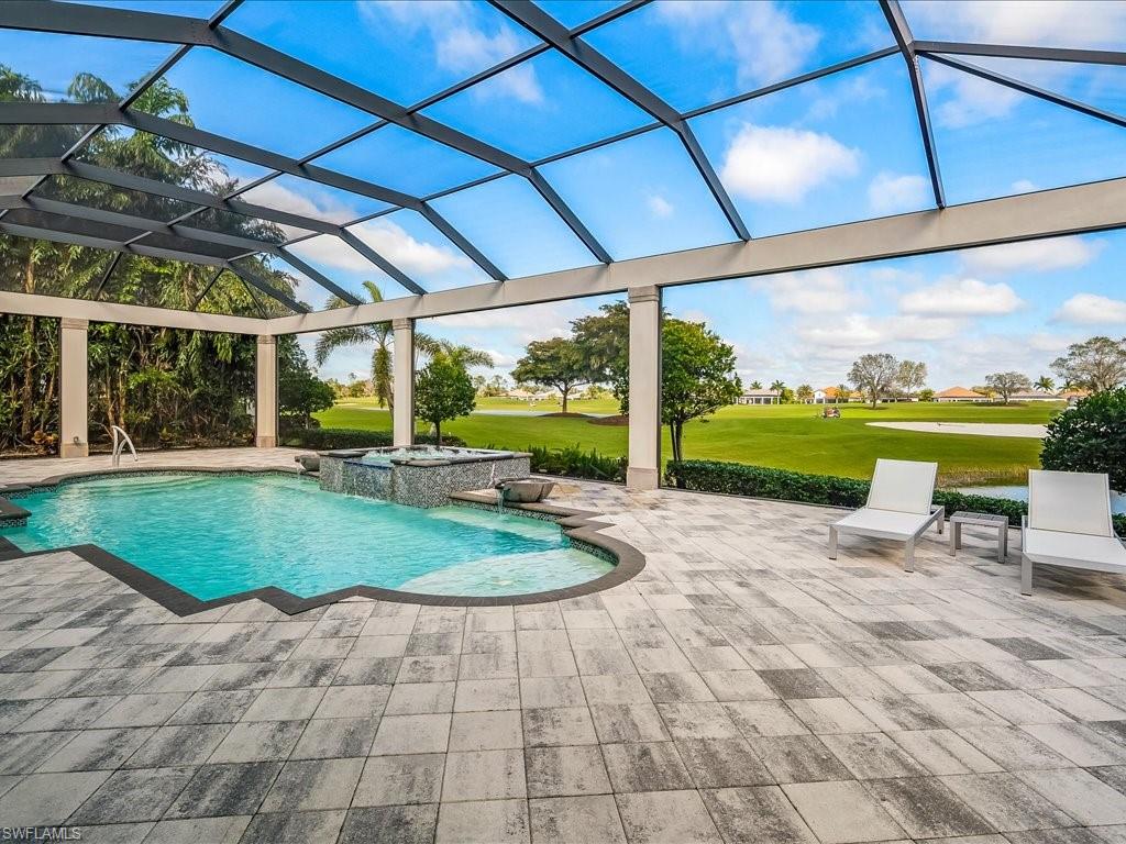 16337 Corsica Way Naples, FL 34110 - Photo 27 of 47 a view of a house with backyard sitting area and garden