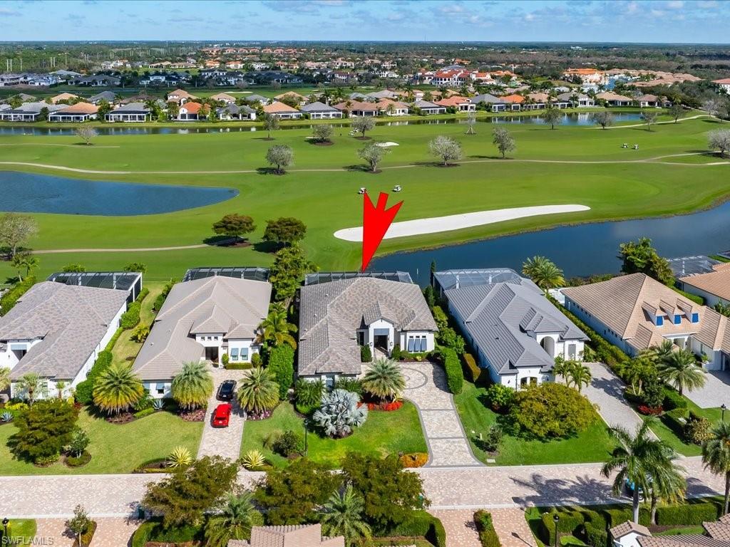 16337 Corsica Way Naples, FL 34110 - Photo 29 of 47 an aerial view of a houses with a yard and lake view