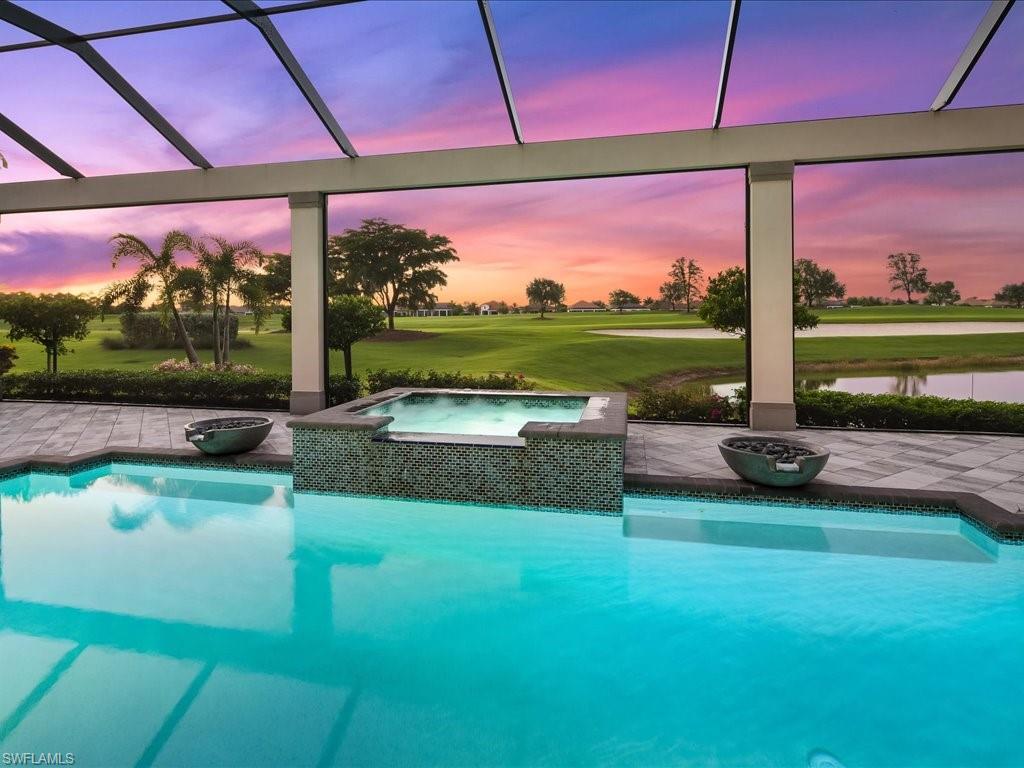 16337 Corsica Way Naples, FL 34110 - Photo 31 of 47 a view of a swimming pool and outdoor seating