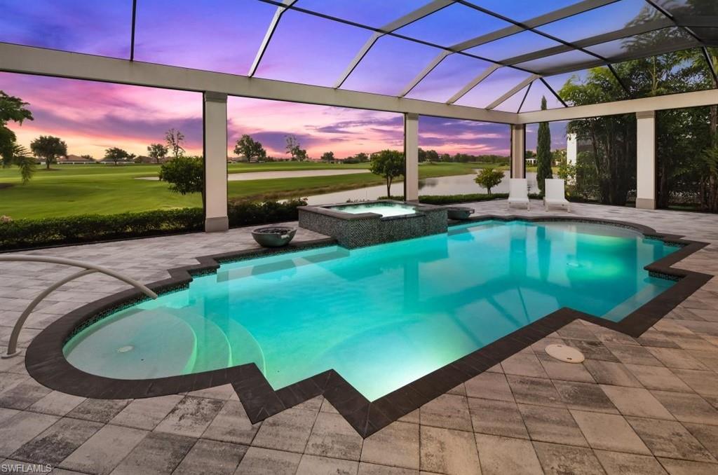 16337 Corsica Way Naples, FL 34110 - Photo 42 of 47 a view of a swimming pool with a patio