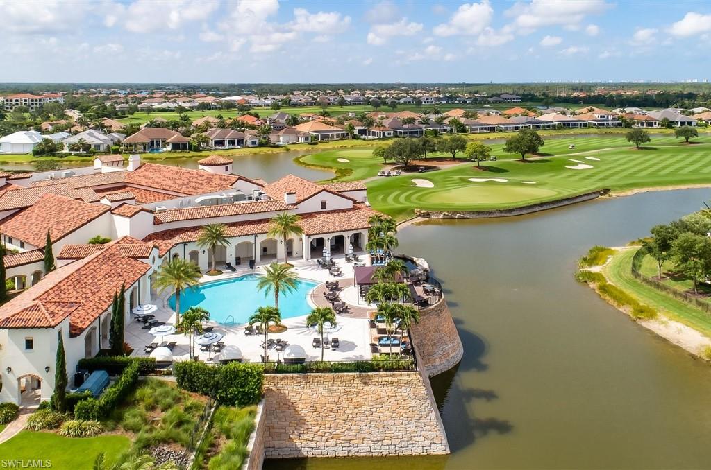 16337 Corsica Way Naples, FL 34110 - Photo 45 of 47 an aerial view of residential houses with outdoor space and lake view in back