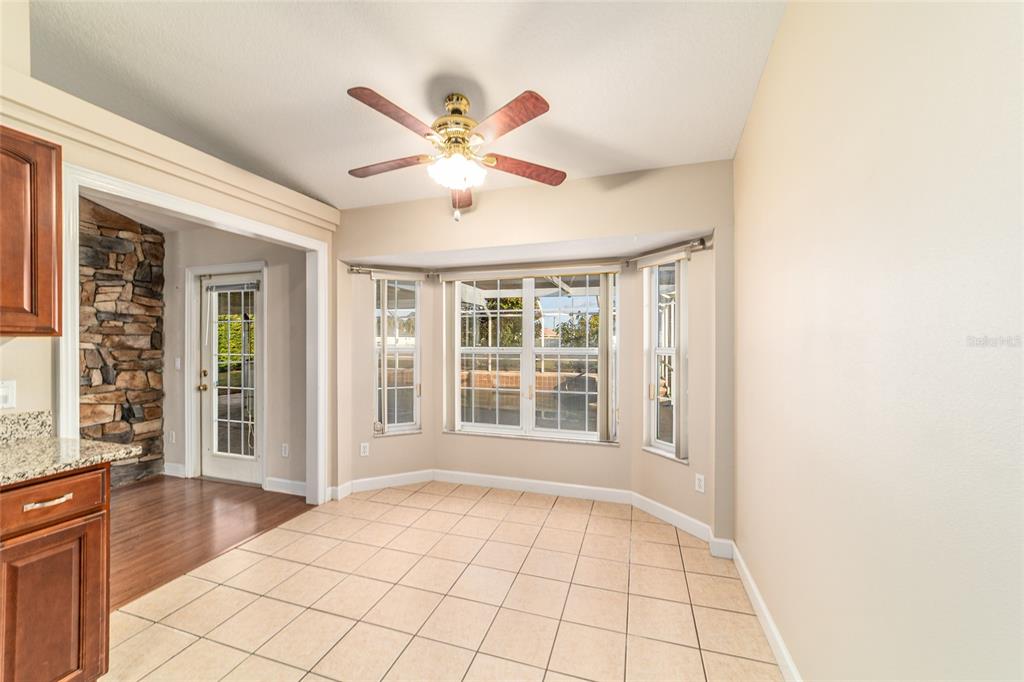 9611 Southwest 45th Avenue Ocala, FL 34476 - Photo 20 of 56 a view of an empty room with window and chandelier fan