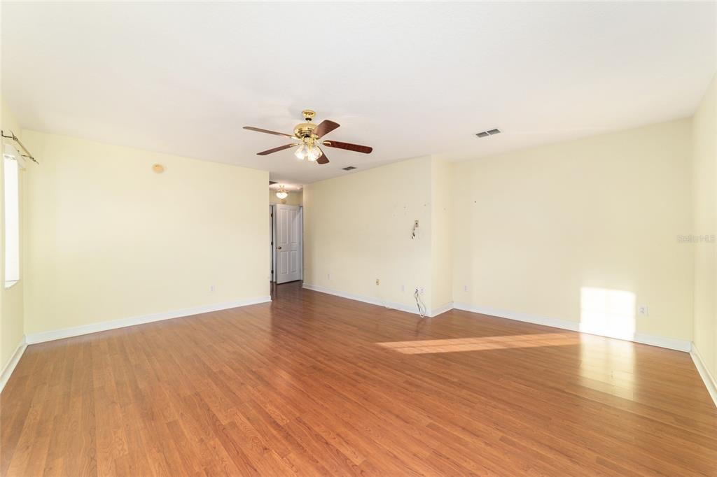 9611 Southwest 45th Avenue Ocala, FL 34476 - Photo 23 of 56 wooden floor in an empty room