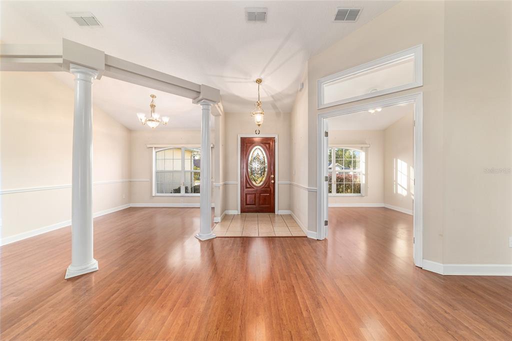 9611 Southwest 45th Avenue Ocala, FL 34476 - Photo 4 of 56 a view of a big room with wooden floor and a window