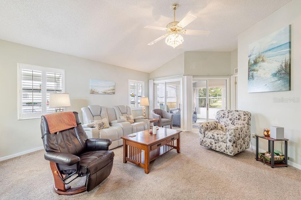 6555 Wilander Street Leesburg, FL 34748 - Photo 12 of 45 a living room with furniture and a large window