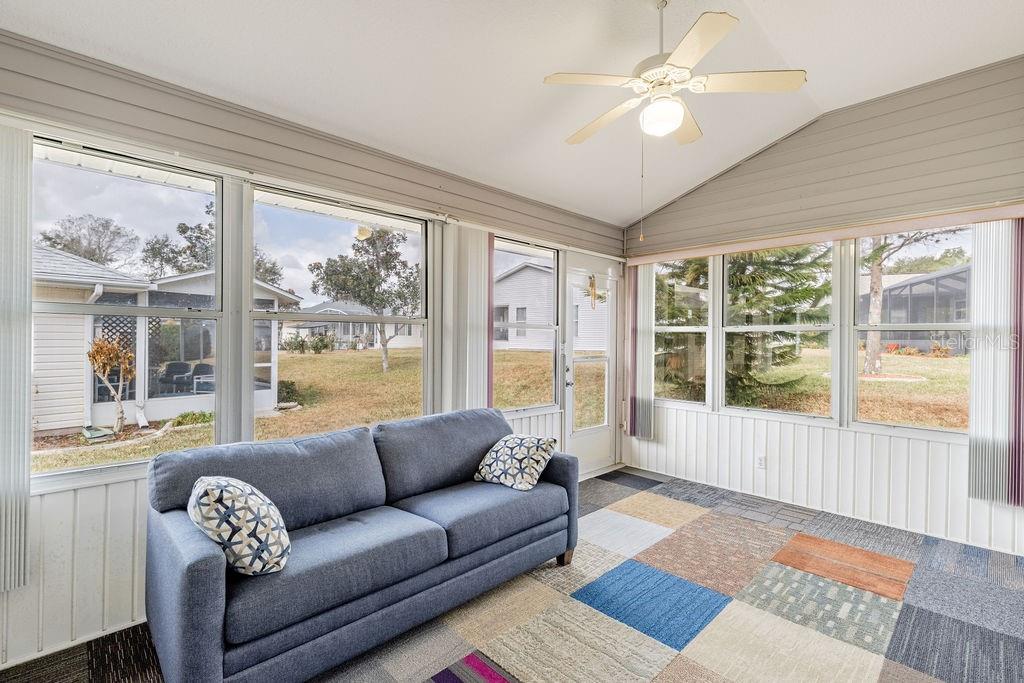 6555 Wilander Street Leesburg, FL 34748 - Photo 17 of 45 a living room with furniture and a large window